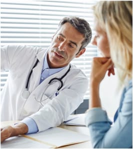 A doctor talks with his patient